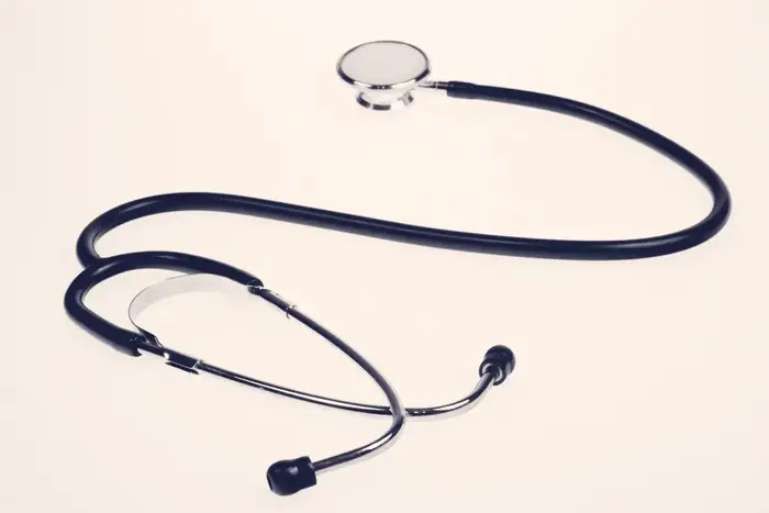 A stethoscope lying on a plain white surface
